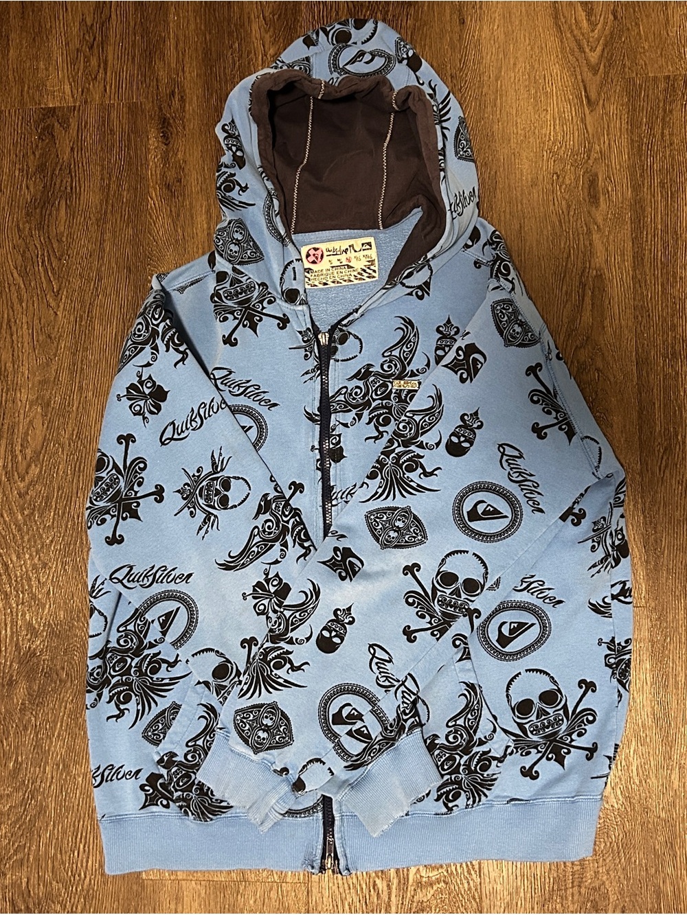 Quiksilver Light Blue Hoodie with Black Skull & Graphic Print